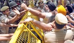 Sikh activists holding a protest outside Jammu & Kashmir House against the killing of a Sikh youth in J&K police firing, in New Delhi on Friday. Tribune photo: Manas Ranjan Bhui
 