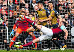 Arsenal lose ground in Carroll’s wonderland