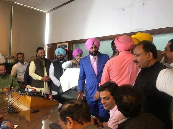 Navjot Sidhu assumes office, promises to do Captain’s bidding