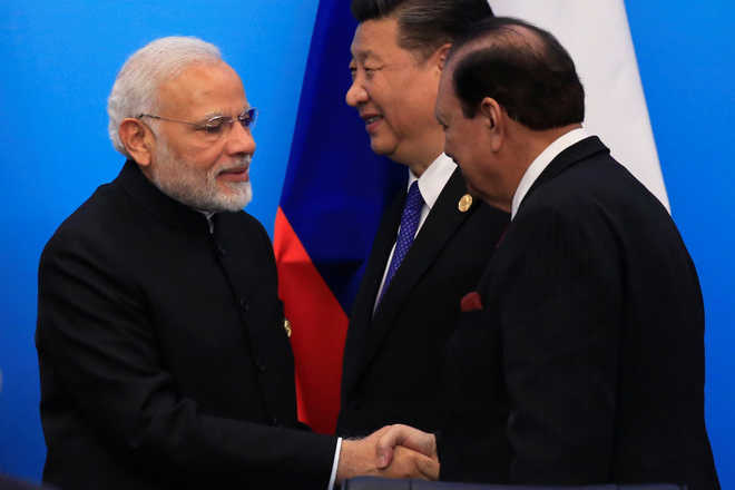 PM Modi, Pak President shake hands at SCO Summit amid strain