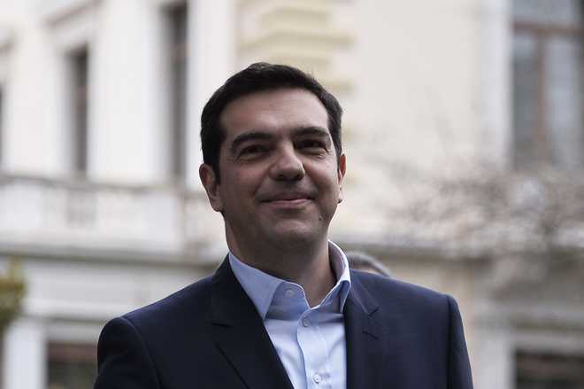 Greek Leftist Tsipras sworn in PM; to fight bailout terms