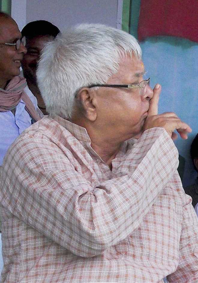 Lalu questions Modi''s silence on reservation policy