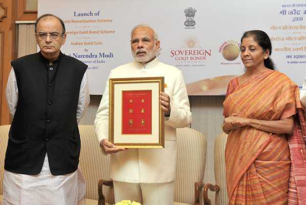 PM launches gold schemes, coin with Ashok Chakra