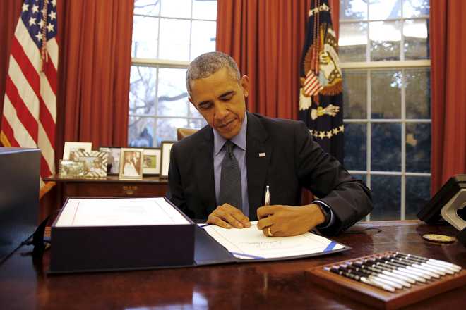 Obama signs Omnibus spending bill into law; raises H1B visa fee