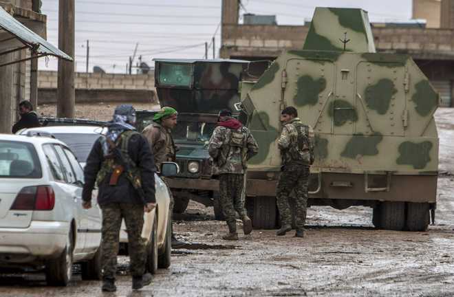 Islamic State under pressure as Kurds take Syrian town