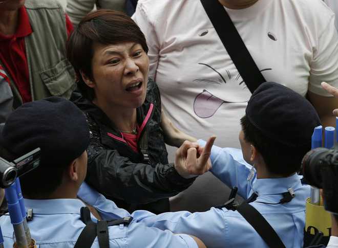 Rally against Chinese shoppers turns chaotic