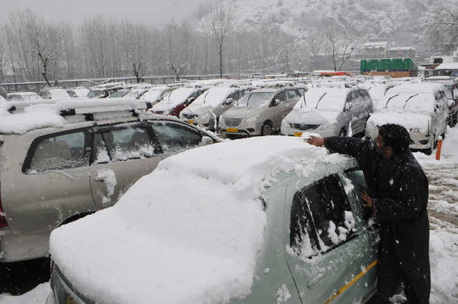 Rain, snow add to commuters’ woes