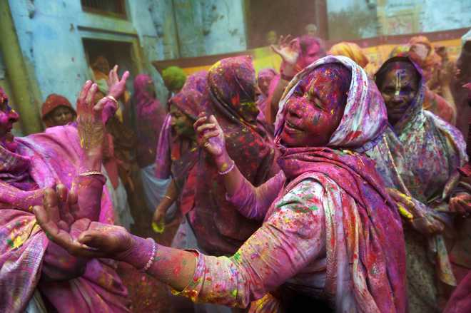 Widows in Vrindavan shun white, drench themselves in Holi colours