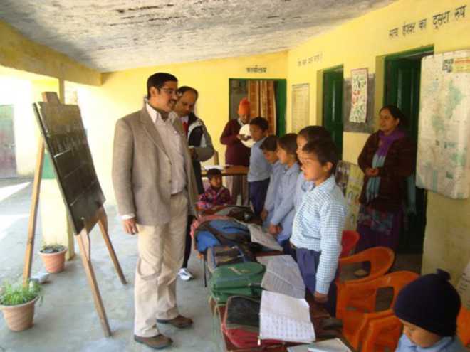 Tehri DM inspects exam centre - The Tribune