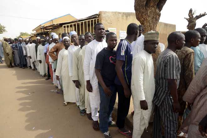 Millions of Nigerians turn out to vote in presidential poll