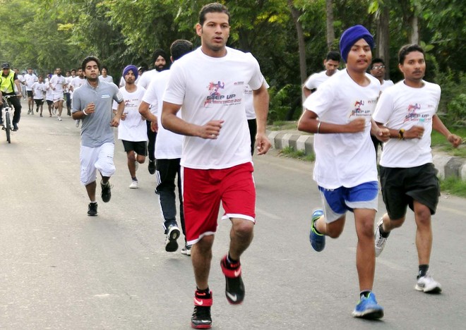 Mini-marathon evokes huge response - The Tribune