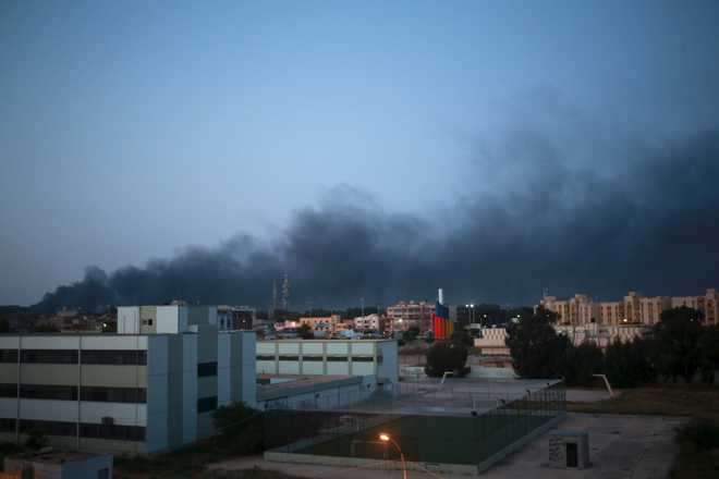 At least 21 killed in fighting near Libyan capital