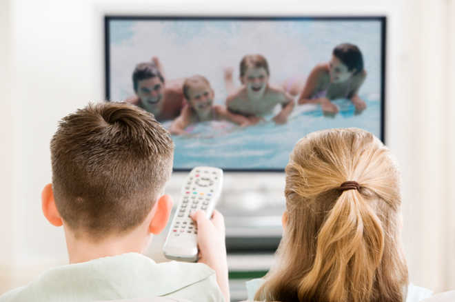 Watching TV for just an hour daily makes kids gain weight