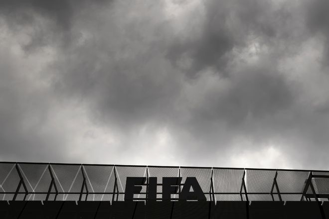 FIFA under dark cloud as top officials held in graft cases