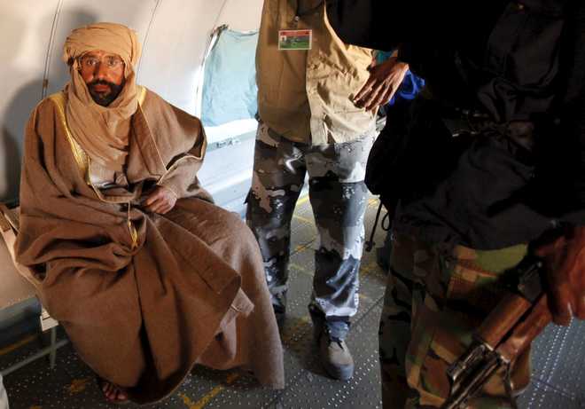 Libyan court sentences Gaddafi son Saif, 7 other ex-officials to death
