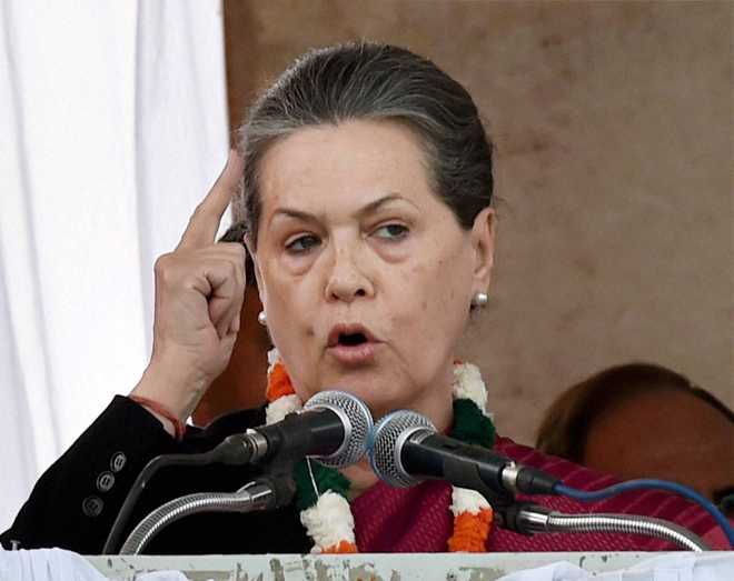 Sonia attacks PM Modi, firm on resignations