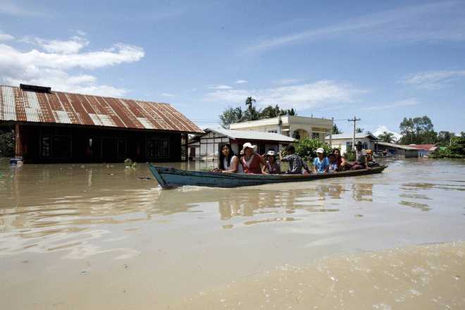 Myanmar rescuers race to flood zones, 46 dead
