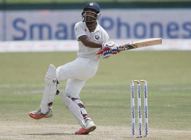 Pujara holds firm for India against Sri Lanka