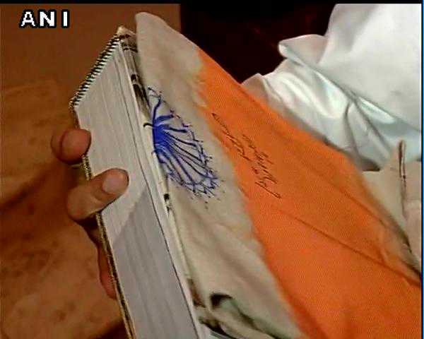 Row over PM signing a cloth painting