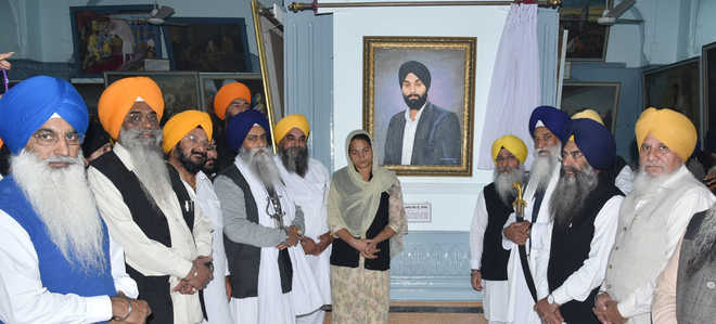Portrait of youth killed in police firing in Sikh museum