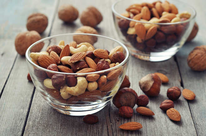 ''Handful of nuts a day may cut heart disease, cancer risk''