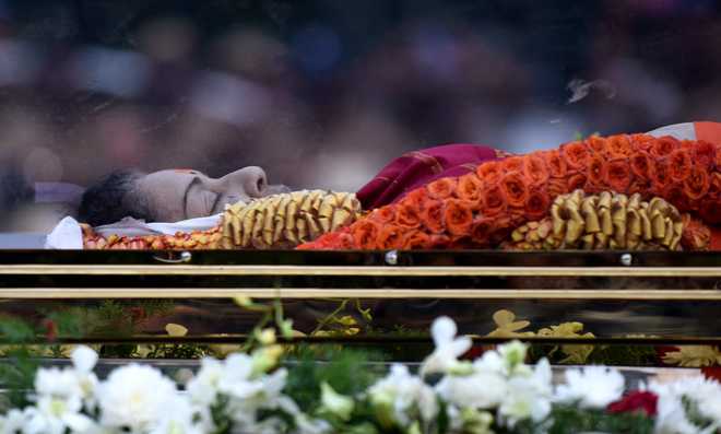 Jayalalithaa laid to rest next to political mentor MGR