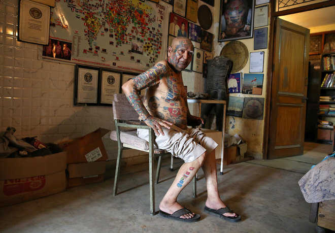 For world records, no teeth, 500 tattoos