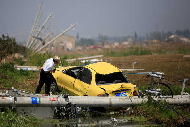 China’s tornado toll goes up to 99