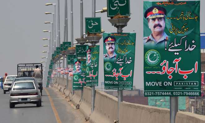 Banners across Pak ask army chief to ''impose martial law''