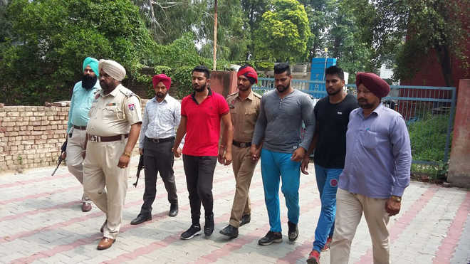 3 held for firing at gym trainer