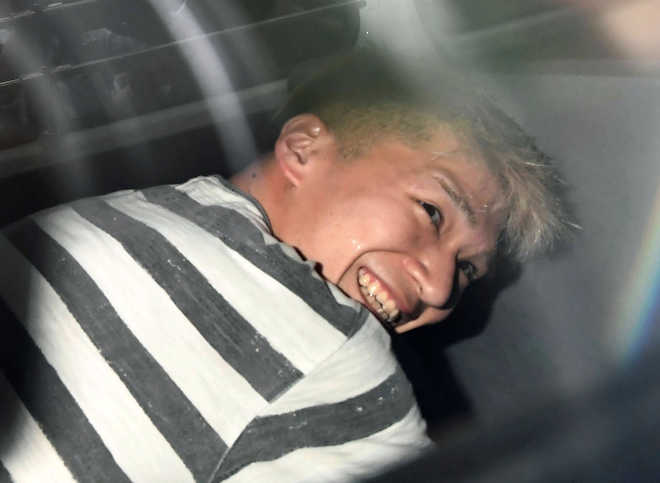 Japanese police raid house of knife attack suspect