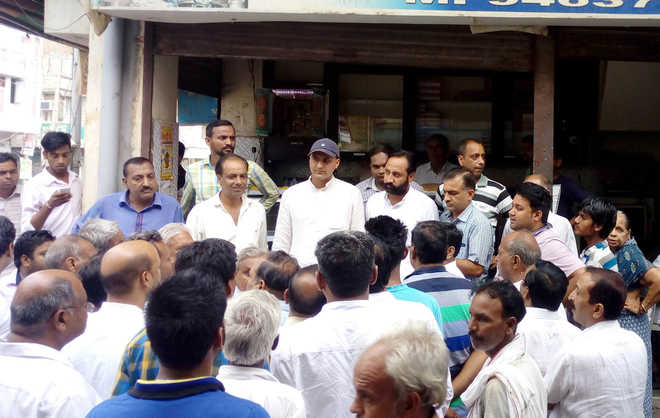 Traders protest against MC for using ‘force’ for tax recovery