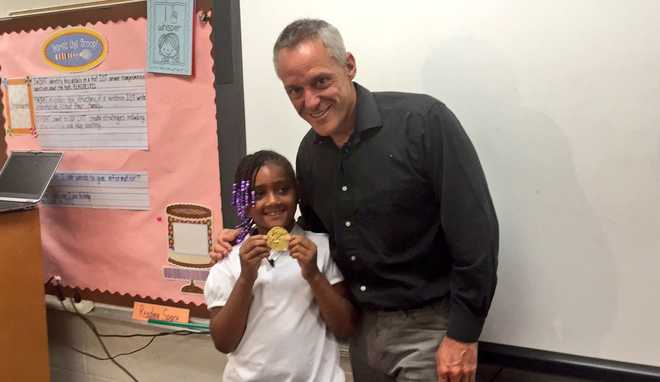 Girl strikes gold by finding stolen Olympic medal in trash