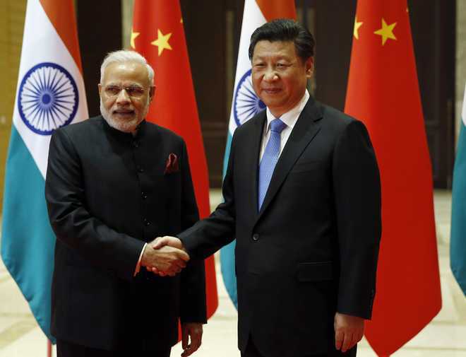 Modi raises China-Pak corridor issue with Xi