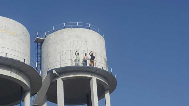 Seeking jobs, 4 ETT union members climb water tank in Badal village