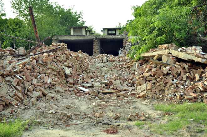 Violating HC orders, part of heritage building demolished : The Tribune ...