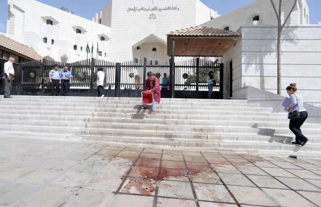 Jordanian writer shot dead outside court before trial over cartoon