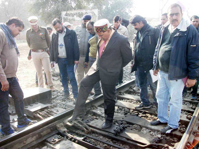 Railways officials inspect tracks