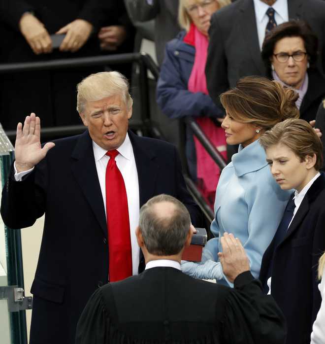 Donald Trump sworn in as 45th President amid violent protests