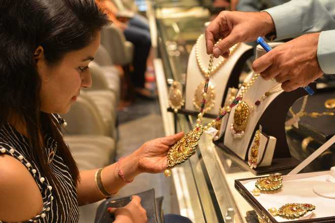 Dhanteras: Gold fails to stage good show, down Rs 140
