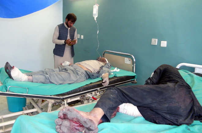Suicide bombers, gunmen kill 47 in attacks on Afghan forces