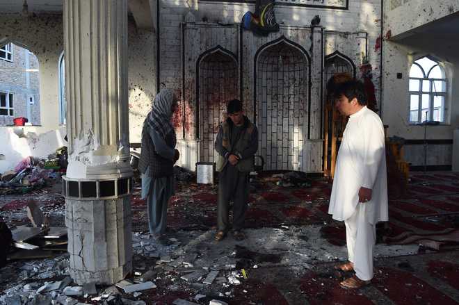 Suicide bombings in Afghanistan hit mosques, killing 63