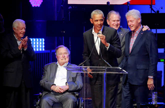 Former US Presidents call for unity at hurricane aid concert