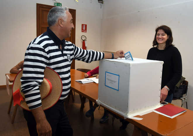 Italians vote in autonomy referendums in shadow of Catalonia crisis