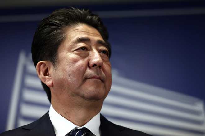 Japan’s Abe to push pacifist Constitution reform after big election win
