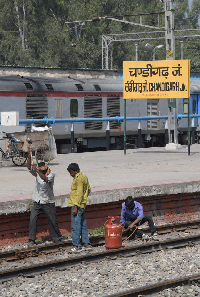 Railway men use cooking gas to repair track