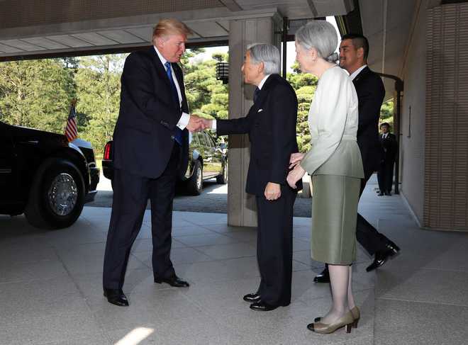 Trump passes tricky protocol test with Japanese Emperor