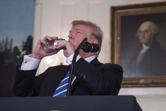 Trump pauses address to nation to take 2 big swigs of water
