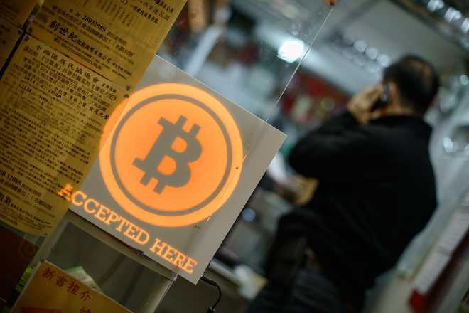 Bubble or brave new world? Bitcoin breaks USD 10,000 barrier
