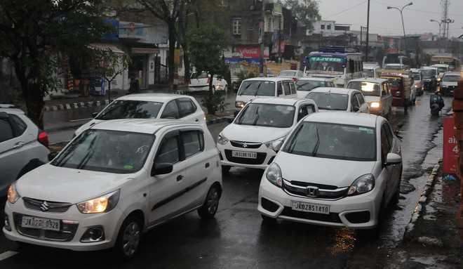 Rain pours misery on city roads